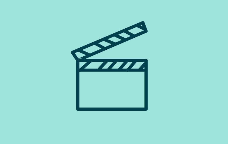 ICON:  an image of a movie making "clapboard" - Social programs include movie nights and other social activities
