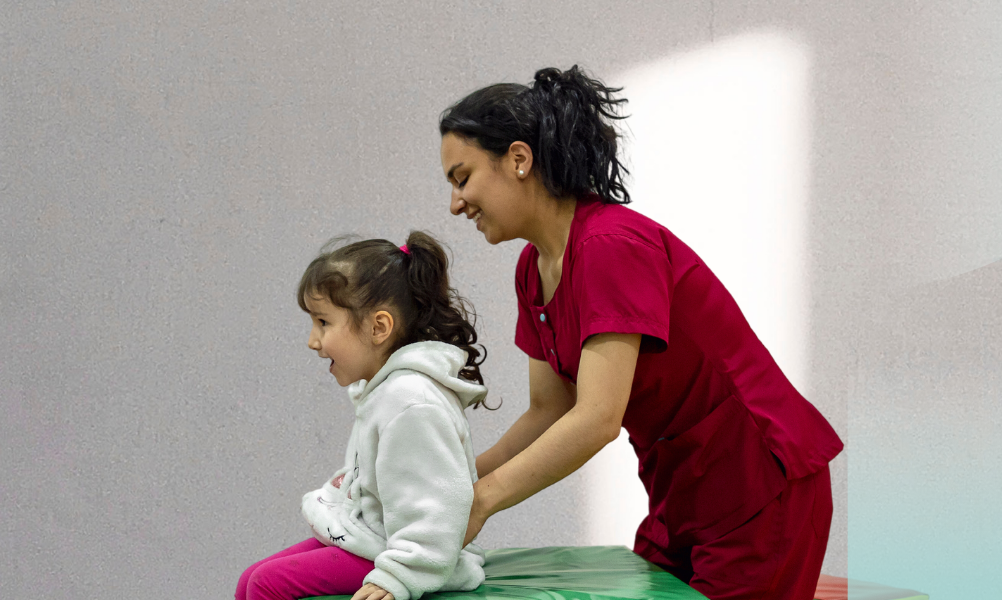 IMAGE: An allied health professional working with a young client on Occupational Therapy