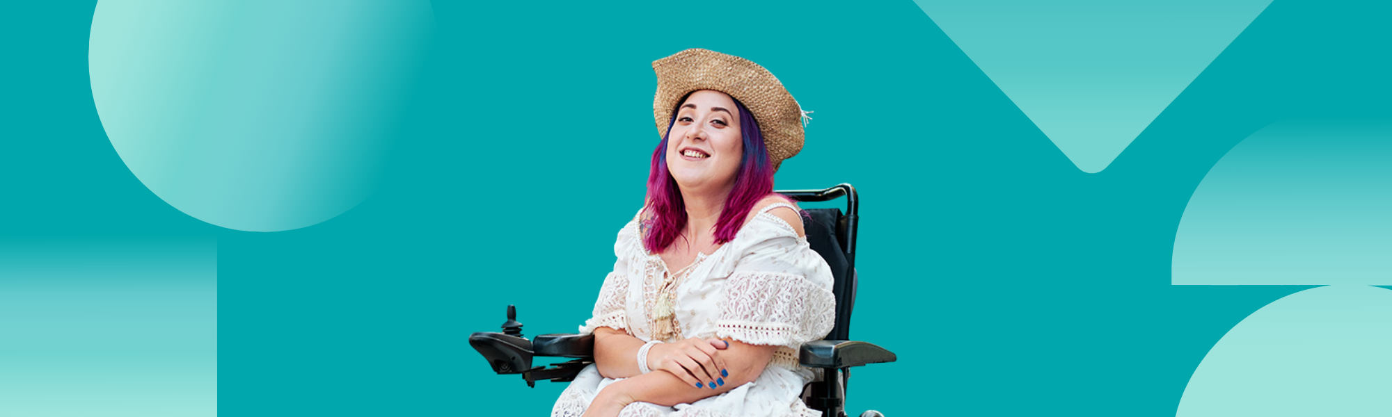 IMAGE: A young woman who uses a wheelchair, smiling